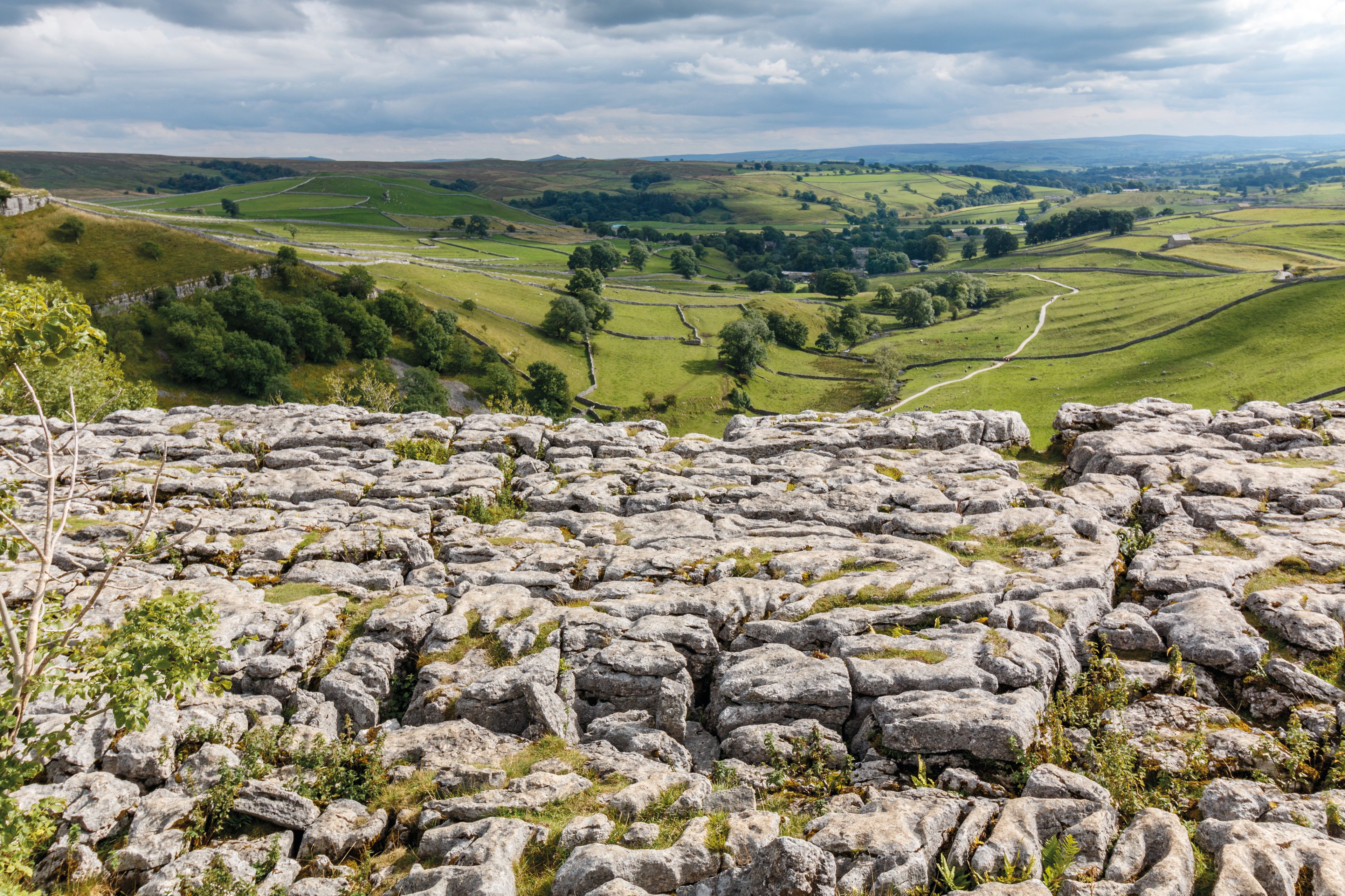 View of Malham Cove on a cloudy day.